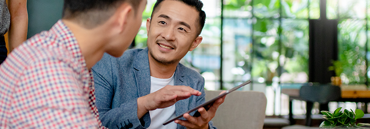 Men discussing corporate risk management plans.